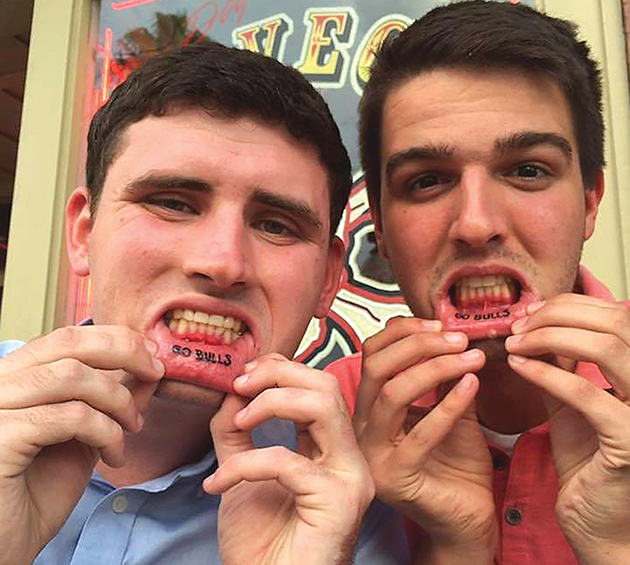 Student body executives follow through on promise, get lip tattoos