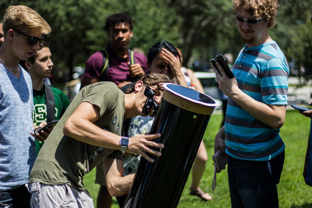 USF campus fills with excitement while viewing solar eclipse