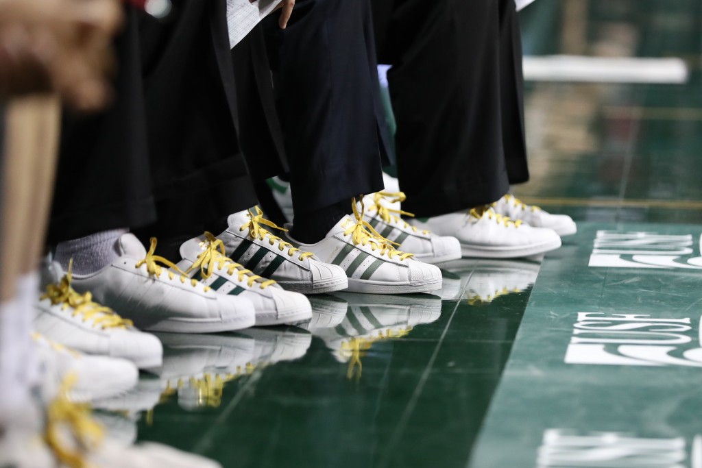 Coaches raise cancer awareness with a change in footwear