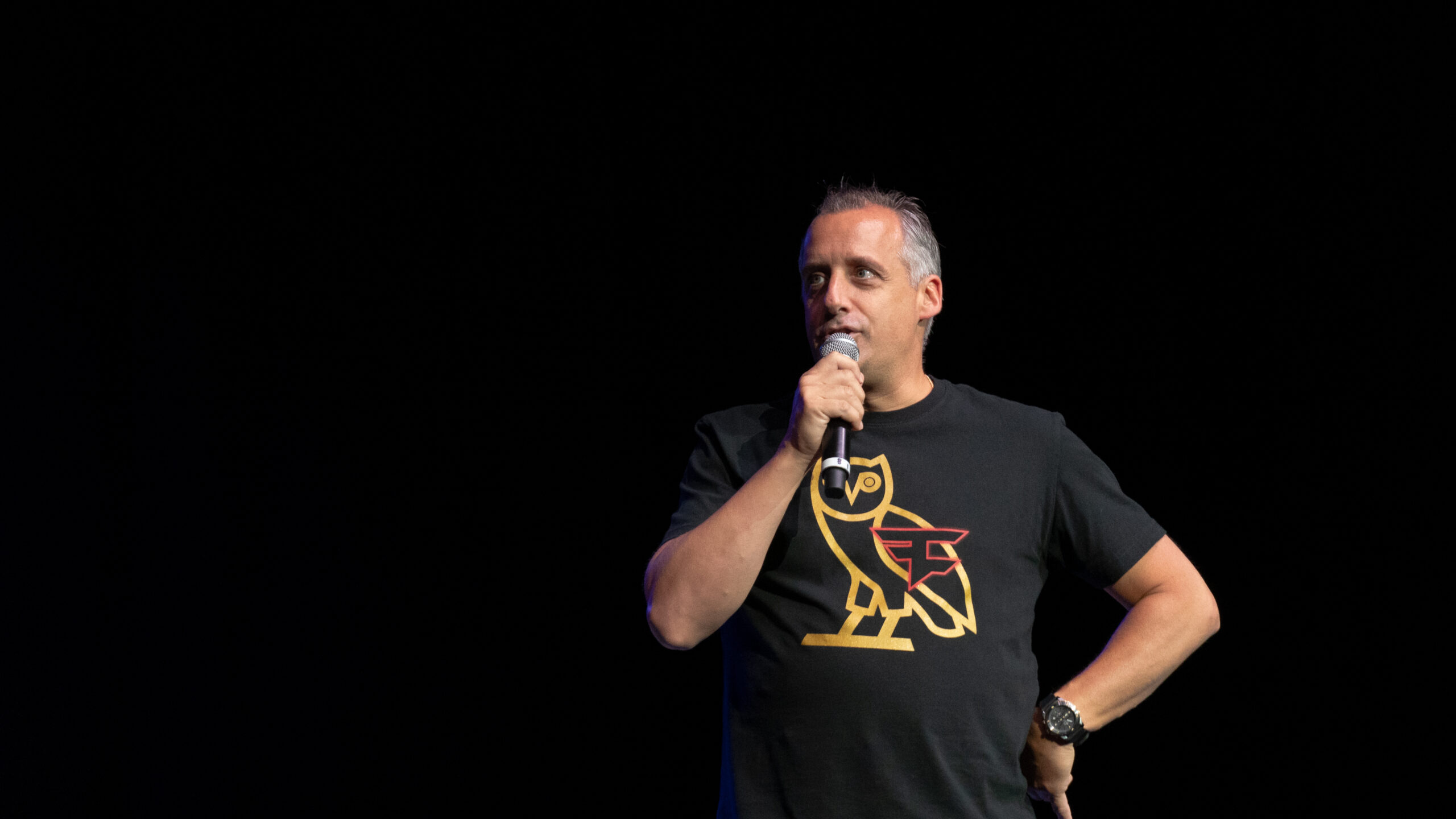 joe gatto from impractical jokers performing at round up comedy show at University of South Florida, Tampa campus. Joe Gatto is speaking into mic